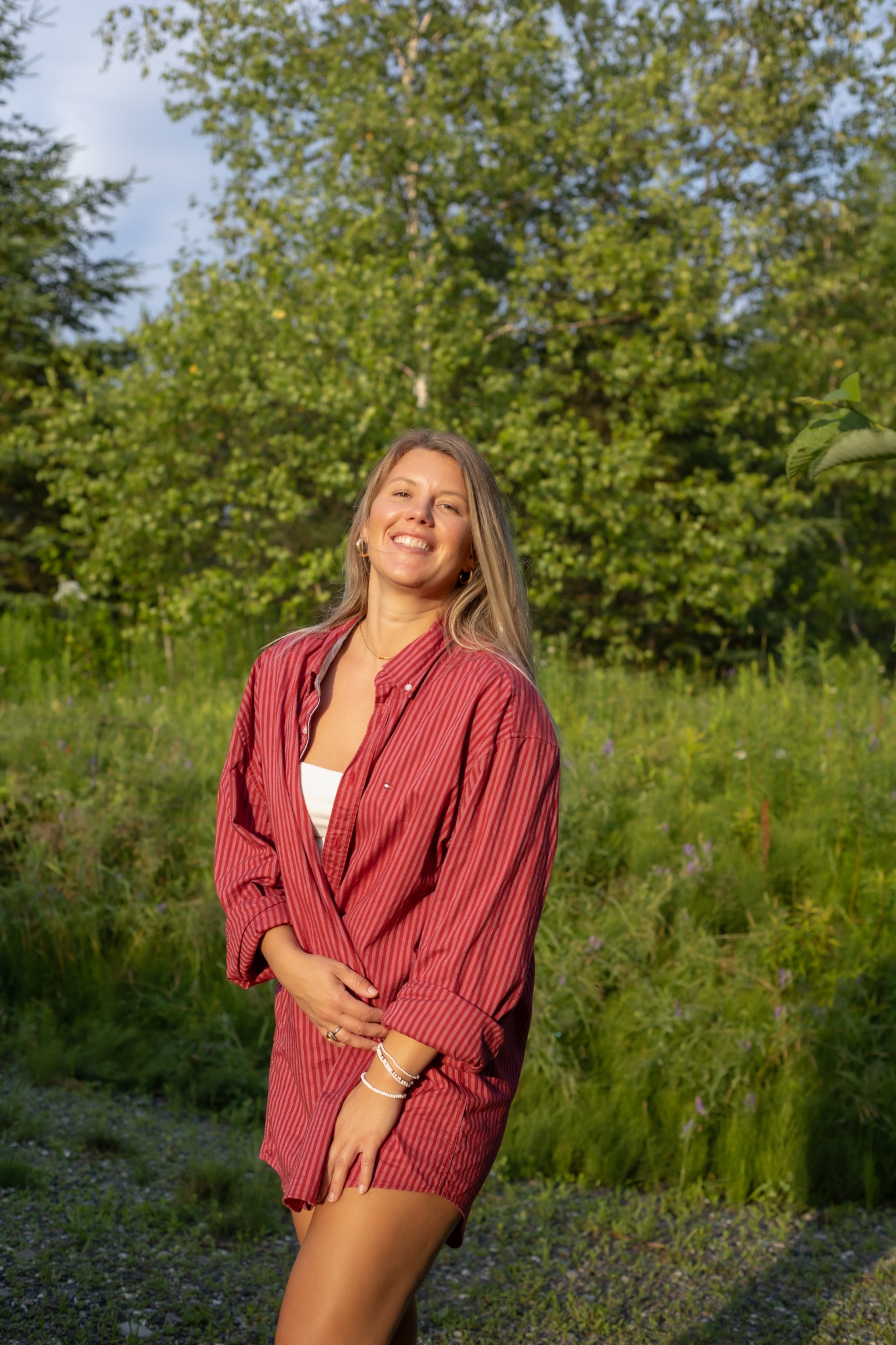 Mariane smiling in a sunlit field